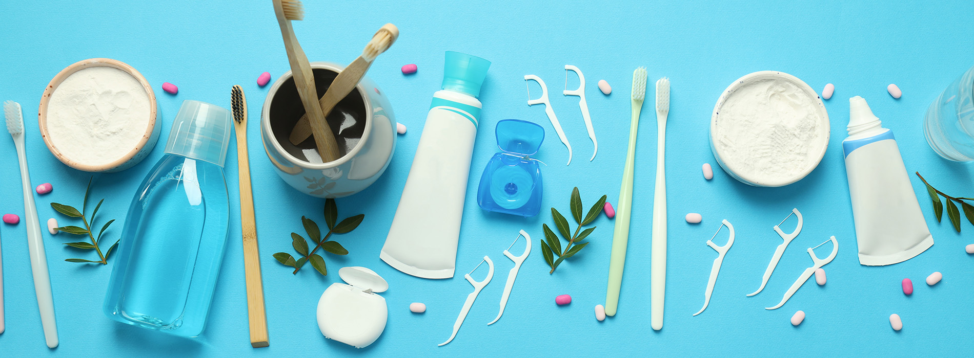 This is a composite image showing medical equipment and supplies, including a stethoscope, blood pressure cuff, tongue depressors, and other instruments, arranged in a manner that suggests they are part of a medical examination or procedure. The background is a solid color to emphasize the items.